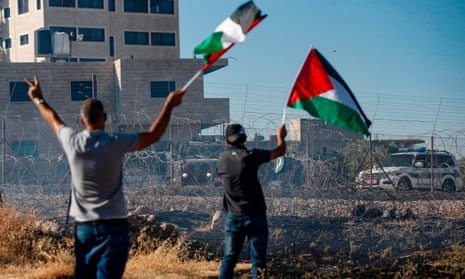 Palestinians protest against an Israeli court-ordered demolition notice for buildings in Beit Sahur, West Bank, July 2019