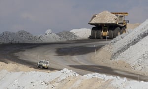 In this Sept. 11, 2012 photo, a four-wheel-drive vehicle follows a large mining truck as it makes its way to the top of a Boggabri coal mine near Gunnedah, Australia, 450 kilometers (280 miles) northwest of Sydney.