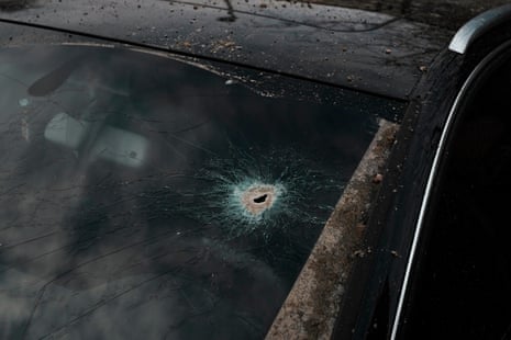 A shrapnel hole in the windshield of a car near the area where an attack took place in Kyiv.