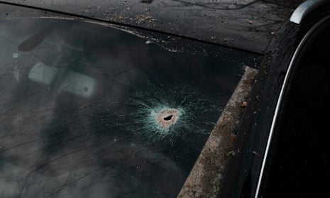 A shrapnel hole in the windshield of a car in Ukraine