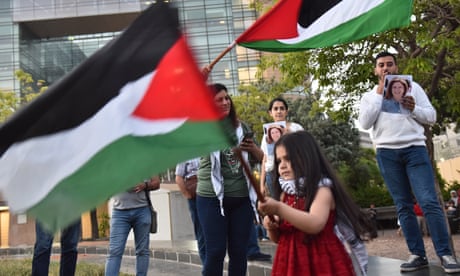 People take part in a vigil outside the UN building in Beirut to denounce the killing of Al Jazeera reporter Shireen Abu Aqleh.