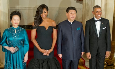  China’s President Xi Jinping and his wife, Peng Liyuan, pose with US first lady Michelle Obama and President Barack Obama at a state dinner in the White House in September 2015.