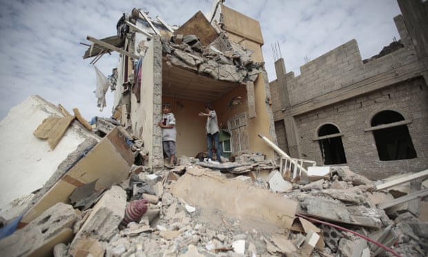 Boys stand on the rubble of a house destroyed by Saudi-led airstrikes in Sana’a, Yemen.