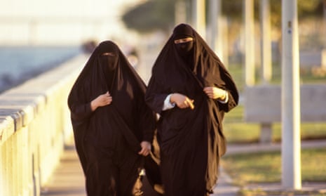 Women stroll along the corniche in Al Khobar, Saudi Arabia.