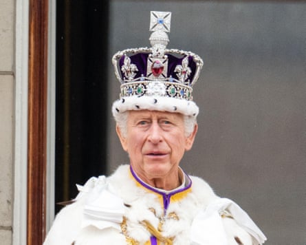 Charles wearing the imperial state crown on the balcony of Buckingham Palace