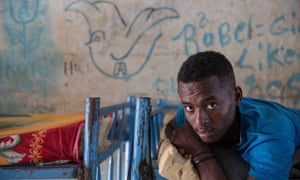 A teenage boy in a dormitory for unaccompanied minors in Shagrab camp, Sudan