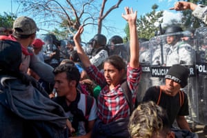 Members of the Mexican national guard scuffle with Central American migrants in Ciudad Hidalgo, Chiapas State, Mexico, on Thursday.