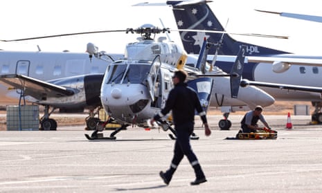A Care Flight helicopter at Darwin airport during rescue work on Sunday after the US military aircraft crash on an island north of the city