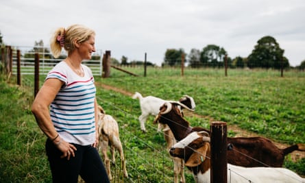 Helen with the farm's goats
