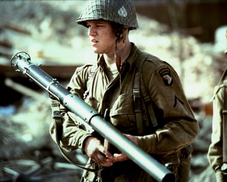 Man in army uniform carries bazooka