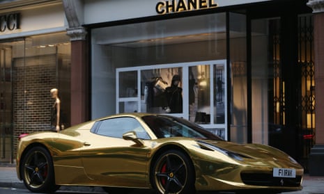 A gold Ferrari at a Chanel store. The super-rich surveyed had an average of £1.1bn.