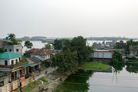 View of a pond surrounded by houses