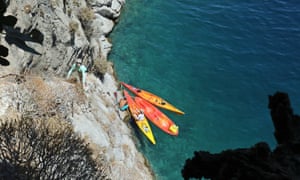 Maddy climbing up to the cave from the kayaks near Vathys on Kalymnos.