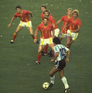 Diego Maradona is confronted by a posse of Belgium defenders.