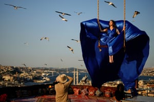 Person with a camera and view over the river