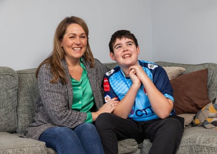 Hannah and Alfie sitting on a sofa.
