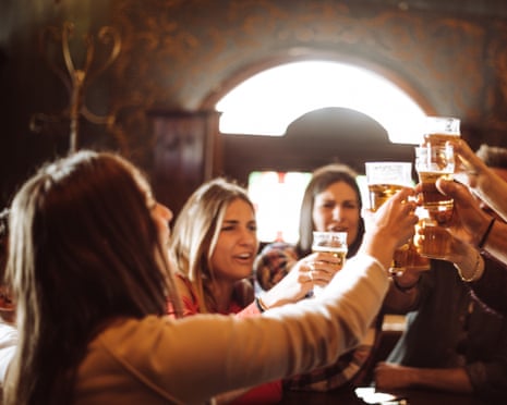 Posed by models
people talking toasting in a pub with the beers