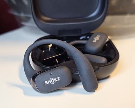A pair of Shokz OpenFit 2 earbuds