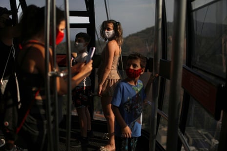 People stand inside a cable car as they visit Sugarloaf Mountain during the reopening, after a months-long closure due to the coronavirus outbreak, in Rio de Janeiro, Brazil, on 15 August, 2020.