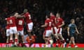 Rhys Priestland is mobbed by his Wales teammates after his penalty secured a last-second win over Australia