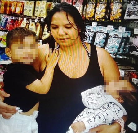 Mary Ann Miller holding two children