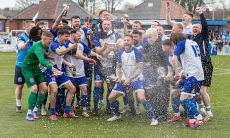 Bury AFC celebrate after clinching promotion from the 10th tier on Sunday.