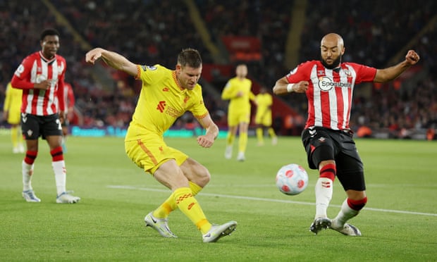 James Milner gets his cross in before Southampton's Nathan Redmond can block.