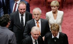 Malcolm Turnbull (centre) leaves the Senate on Monday following the recall of parliament.