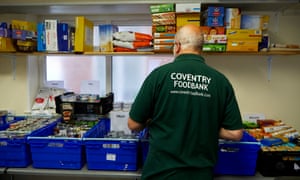 Volunteer preparing emergency food parcels at Coventry Foodbank