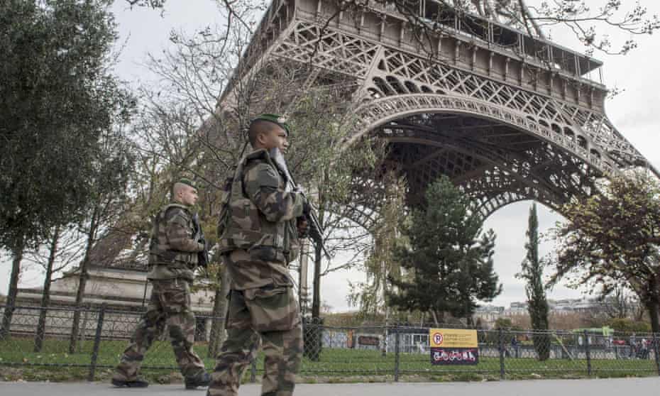 Soldiers on patrol at the Eiffel Tower