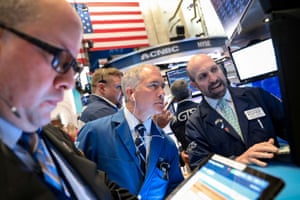 Traders on the floor at the New York Stock Exchange last night.