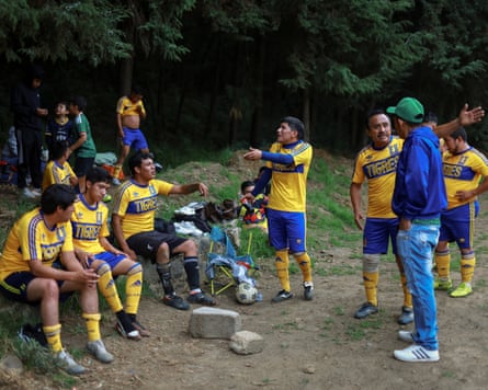 A coach talks his players during an amateur convention match