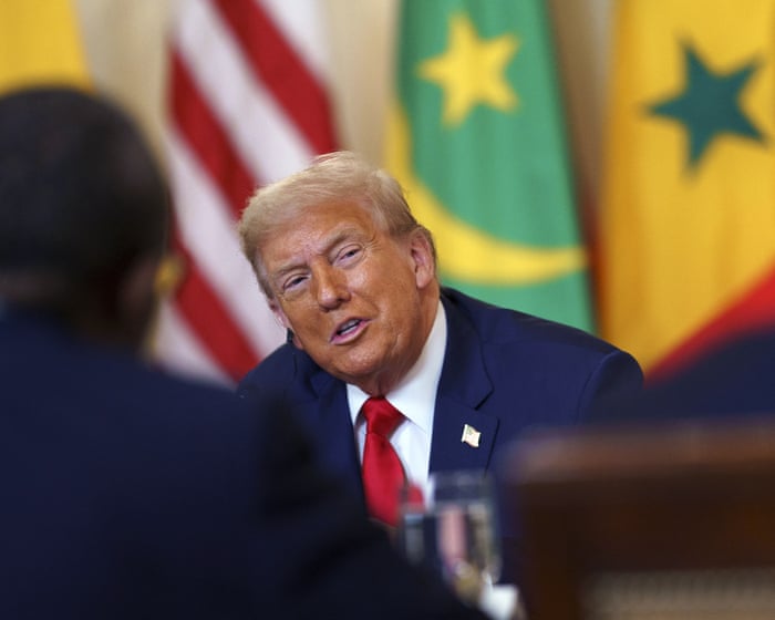 Awkward silence after Trump praises English of Liberian president – video