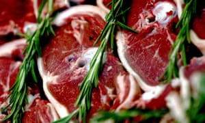 Lamb chops decorate a butchers shop window in London, UK