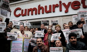 Protesters hold copies of the Cumhuriyet during a demonstration in Istanbul in 2016