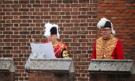 The earl marshal, Edward Fitzalan-Howard, right, as the principal proclamation is read by the garter king of arms.