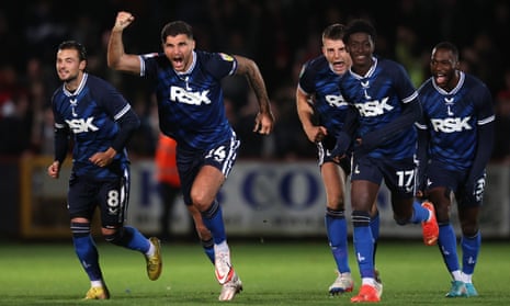 Ryan Inniss and his Charlton Athletic team mates celebrate and rush to congratulate Scott Fraser after he scored the winning goal in the penalty shoot-out.