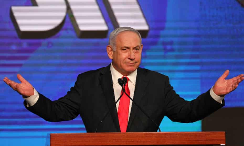 Benjamin Netanyahu greets supporters at the Likud party’s final election event after early exit polls.