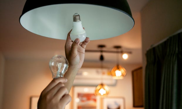 comparing regular and energy-saving lightbulb