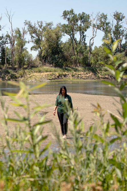 Tayaba walks across a sandbank along the Sacramento River.