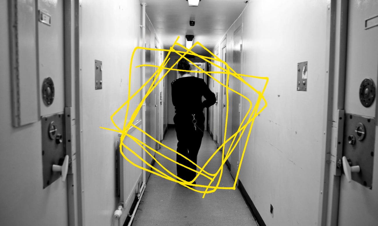 Prison worker walking down corridor