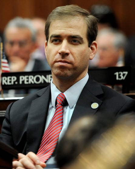 A man in suit and tie.