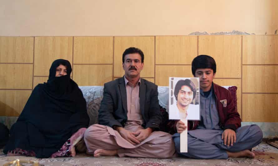Professor Wahid with his wife, youngest son who also is holding the picture of missing Rehmatuallah