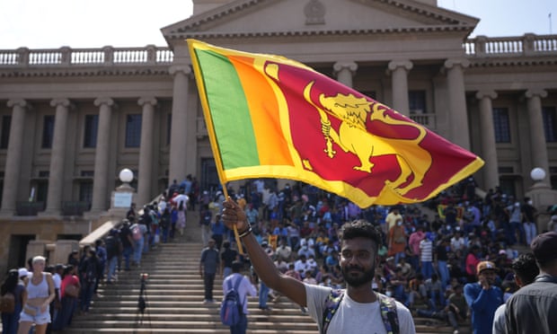 An anti-government protester outside president Gotabaya Rajapaksa's office in Colombo on Wednesday as crowds awaited his official resignation.