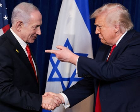 Donald Trump points his finger towards Israeli Prime Minister Benjamin Netanyahu as they shake hands during a press conference after meeting at Trump’s Mar-a-Lago club in December