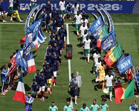 French, left, and Senegalese players take to the pitch.