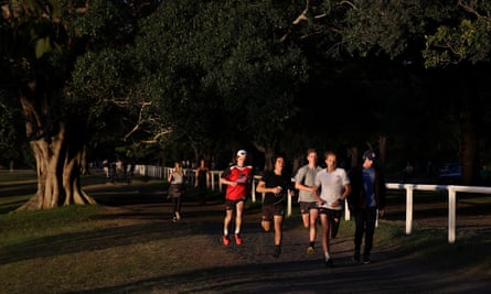 People exercise in Centennial Park amidst the easing of restrictions implemented to curb the spread of the coronavirus disease in Sydney, Australia