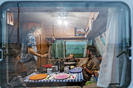 Alice, Fabio and Martin in the caravan where they live for most of the year.