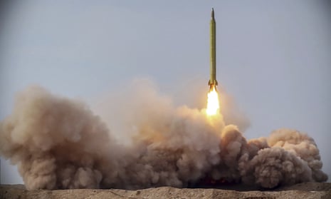 A missile is launched in a drill in Iran. 