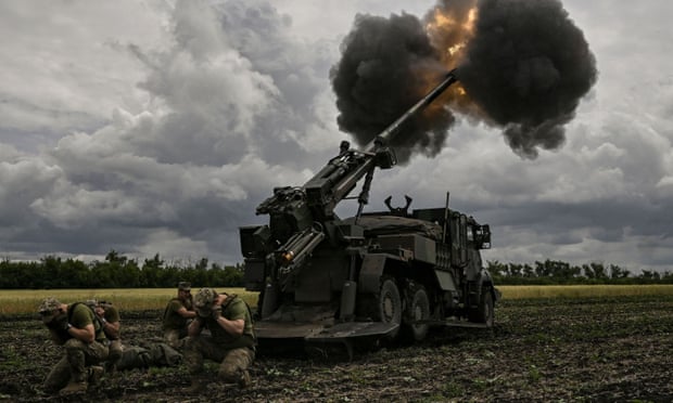 Ukrainian servicemen fire a French Caesar howitzer at Russian positions in Donbas last month